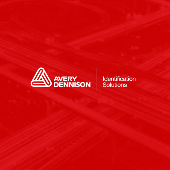 Graphic of highways with the Avery Dennison Identification Solutions logo in the middle of it