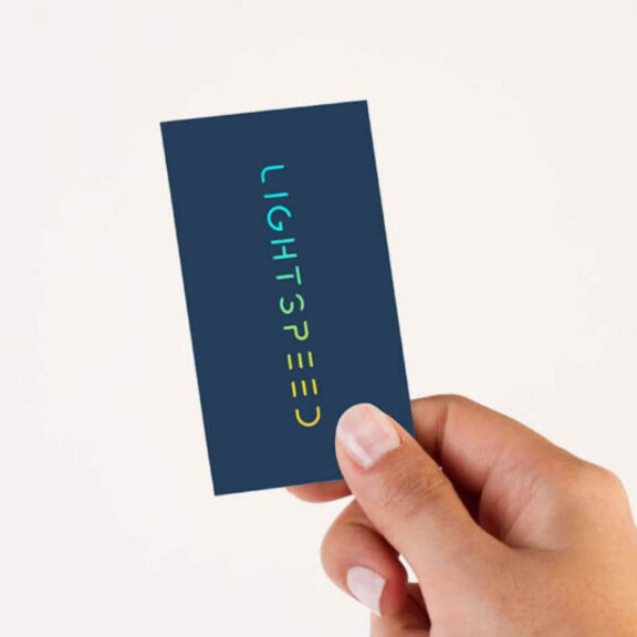 Photo of a person's hand holding up a LightSpeed brand card