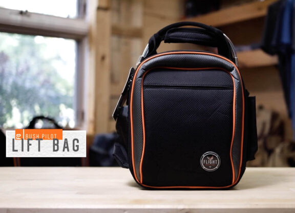Graphic of a black and orange bag with a text box that says 