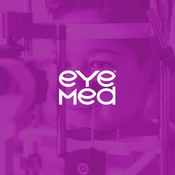 Photo of a boy getting his eyes examed with a purple filter over the image and a white EyeMed logo in the center