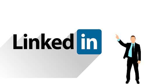White graphic with the black and blue LinkedIn social media logo with an illustration of a man in a suit pointing to it